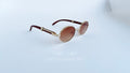 Ochelari de soare Cartier Giverny Style cu rame aurii și maro și lentile degrade maro, eleganți pentru bărbați.