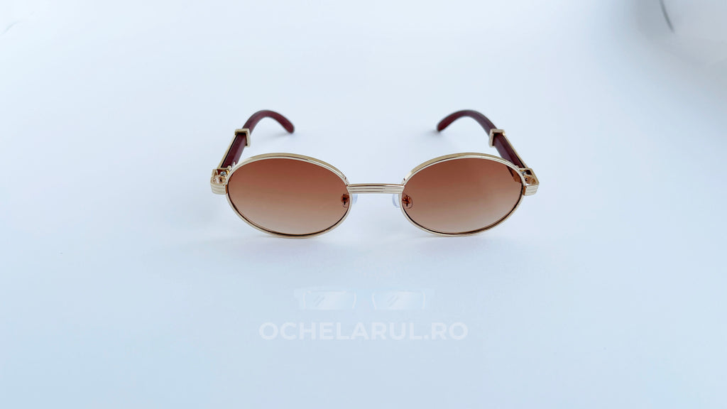 Ochelari de soare Cartier Giverny Style cu rame aurii și lentile maro degrade, design elegant și modern.