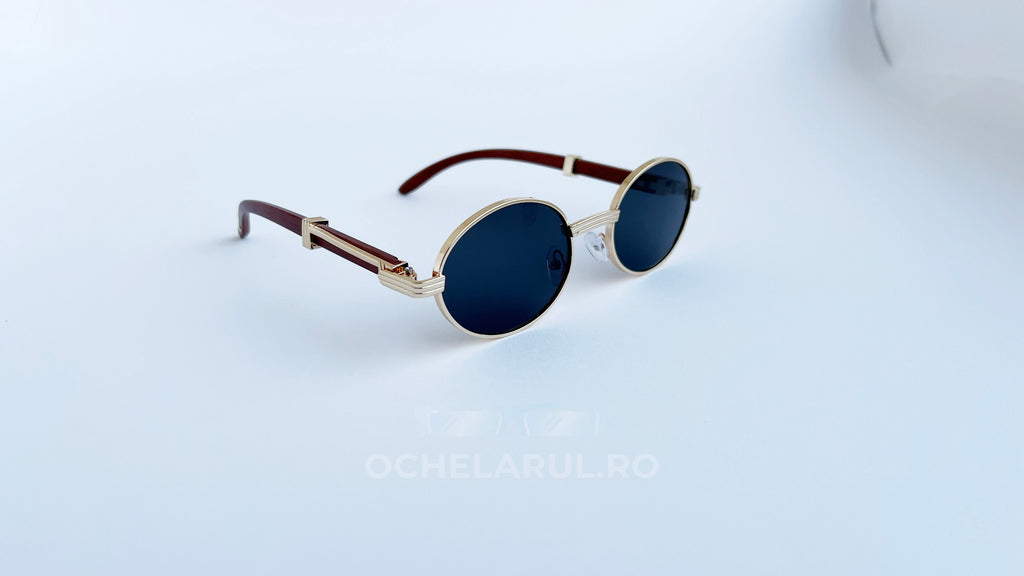 Ochelari de soare Cartier Giverny Style cu rame aurii, brațe maro și lentile negre rotunde, eleganți pentru bărbați.