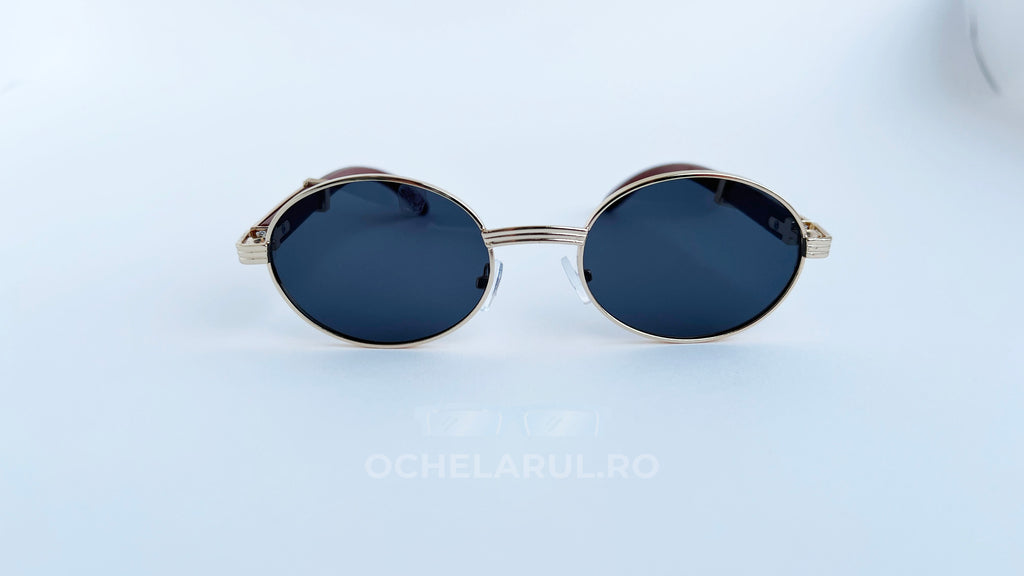 Ochelari de soare Cartier Giverny Style cu rame aurii și lentile negre, design oval elegant pentru bărbați.