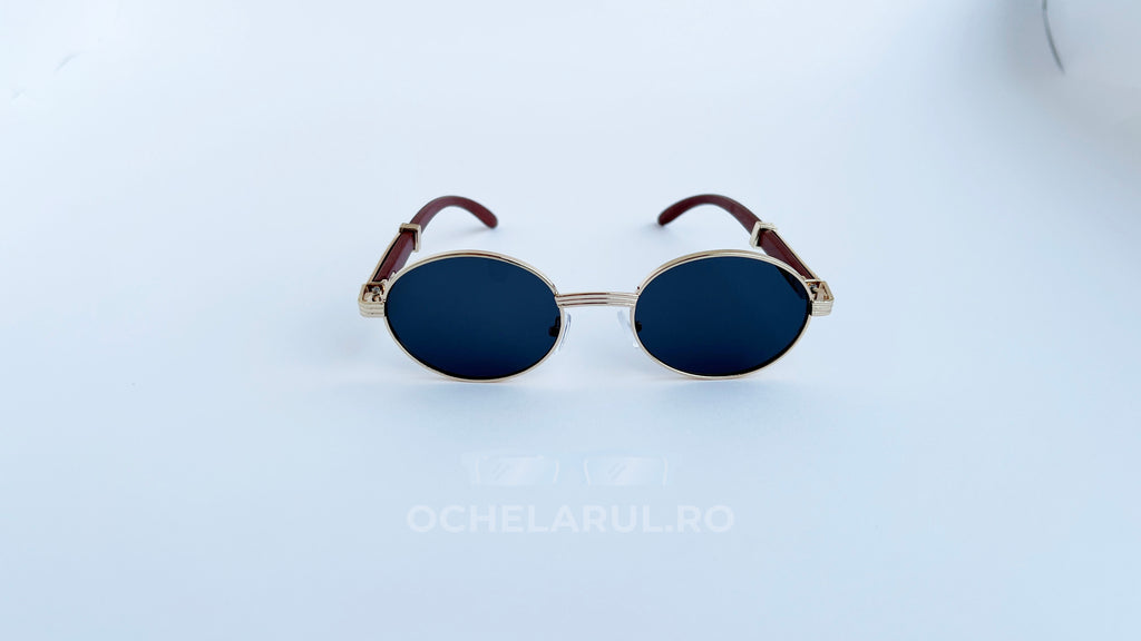 Ochelari de soare Cartier Giverny Style cu rame aurii și maro și lentile negre, design oval elegant.