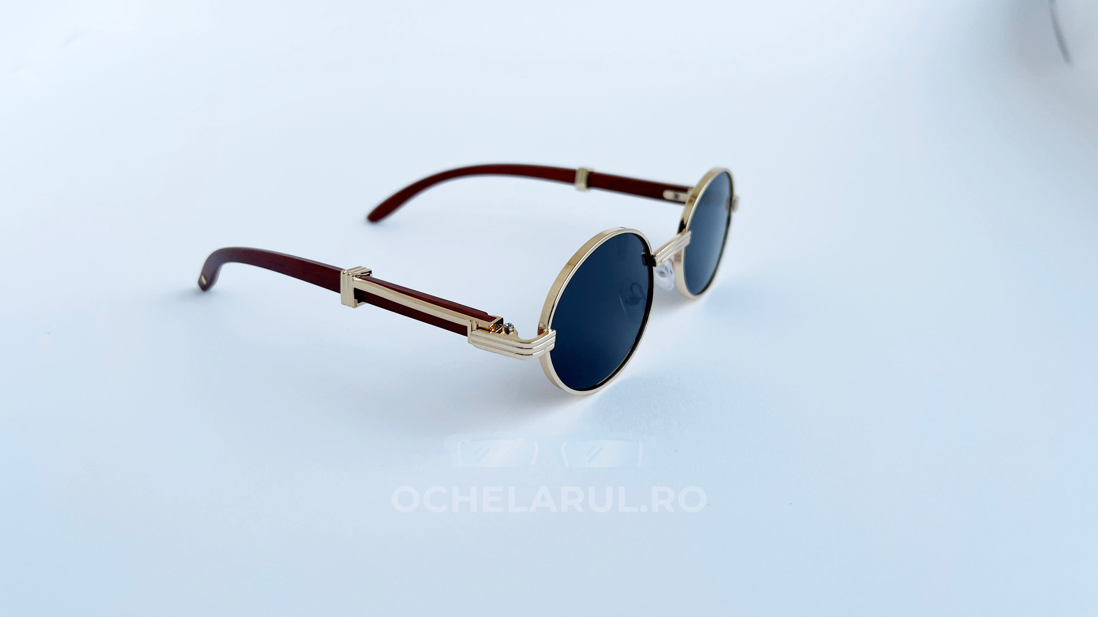 Ochelari de soare Cartier Giverny Style cu rame aurii și maro, lentile negre rotunde, elegant pentru bărbați.