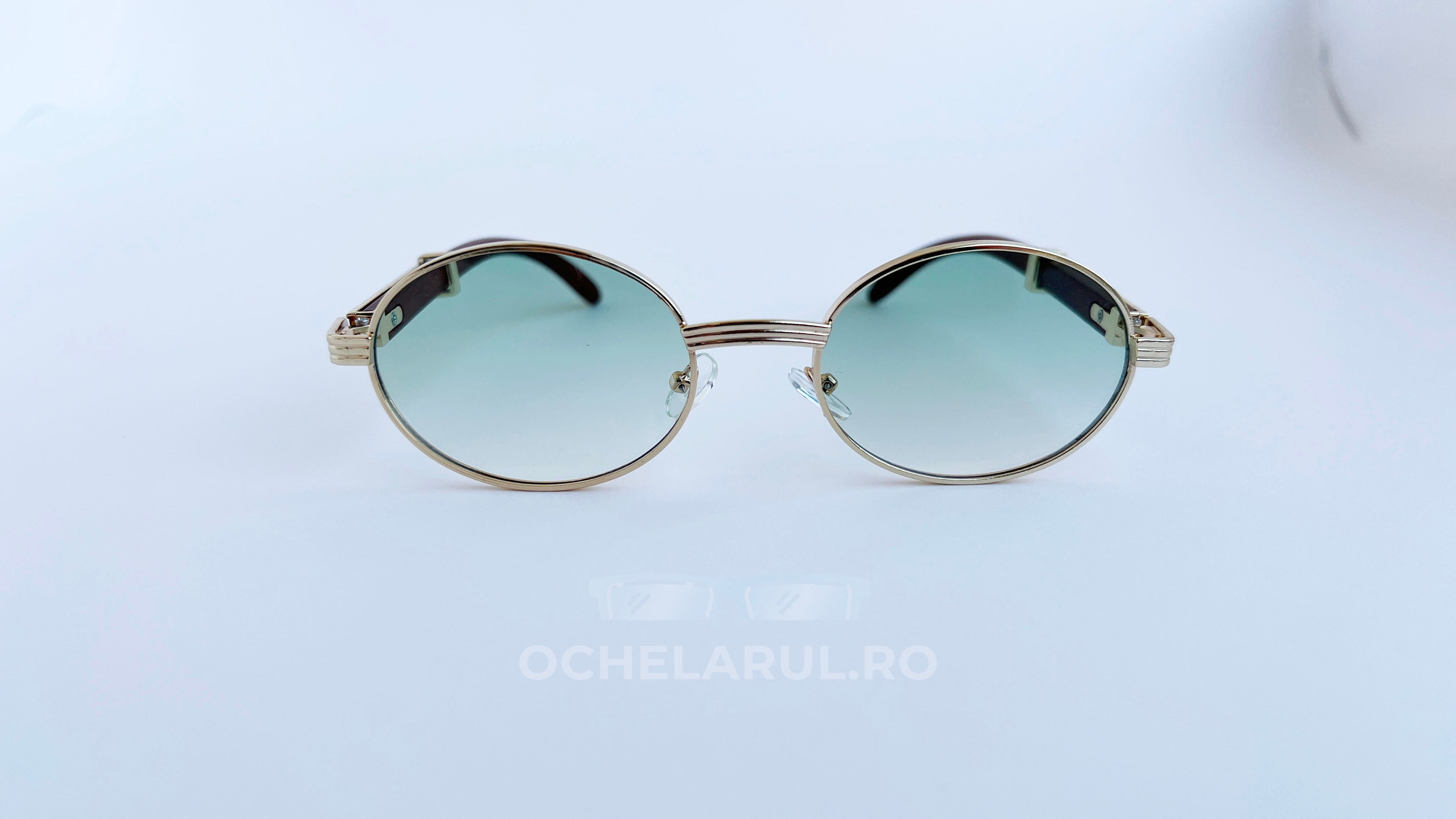 Ochelari de soare Cartier Giverny Style cu rame aurii și lentile verzi degrade, design elegant și modern.