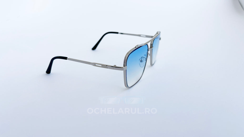 Ochelari de soare Dita Mach Six Style cu rame argintii și lentile albastre degrade, design modern pentru bărbați.