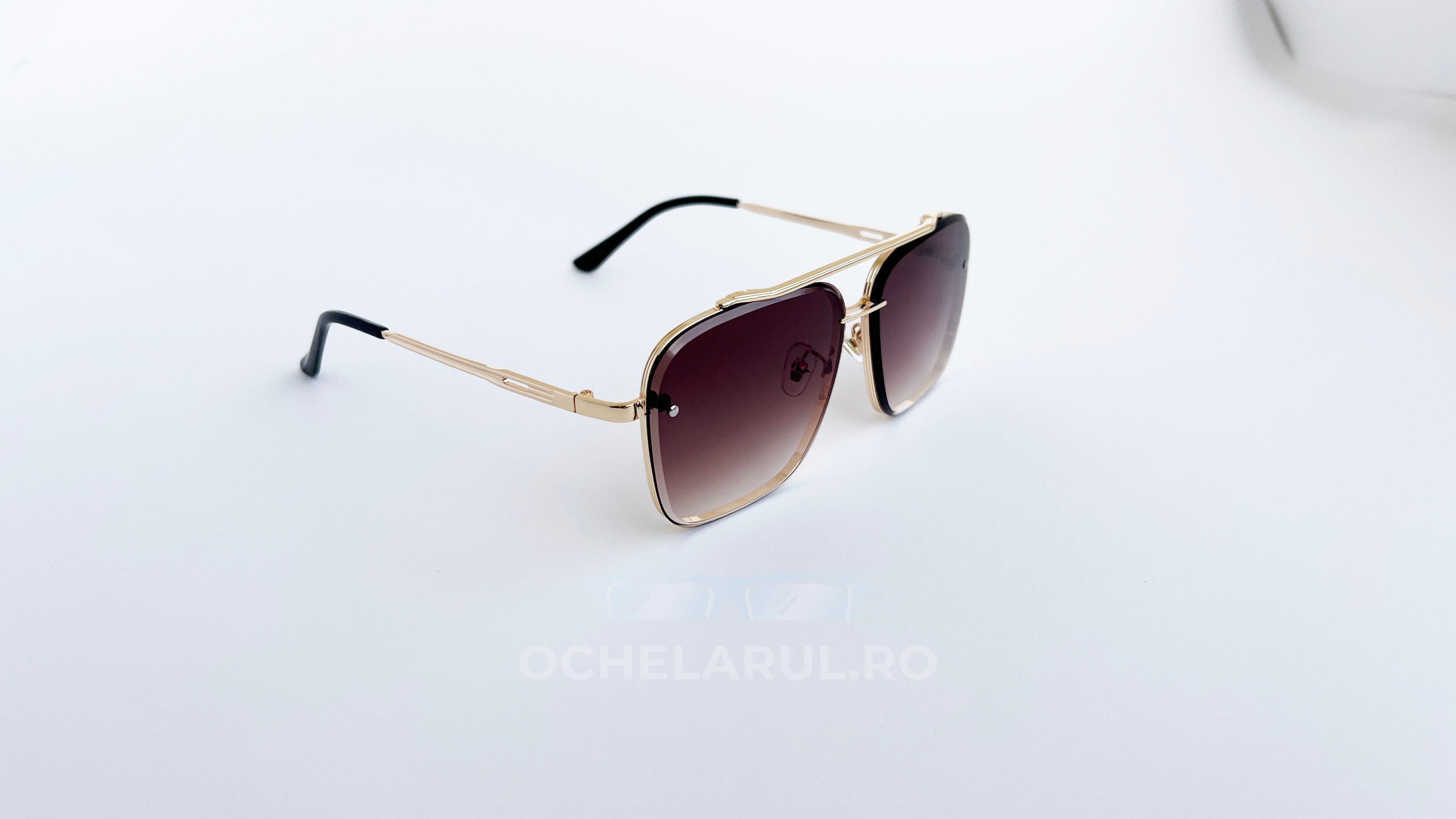 Ochelari de soare Dita Mach Six Style cu rame aurii și lentile maro în degrade, stil modern și elegant.