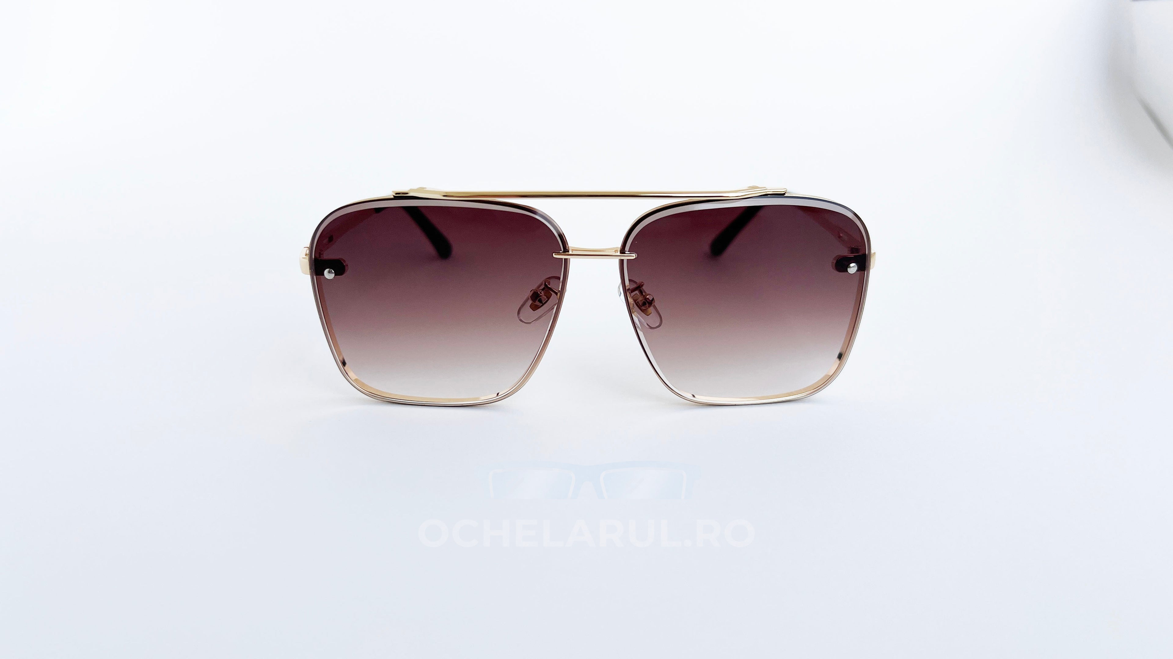 Ochelari de soare Dita Mach Six Style cu rame aurii și lentile maro în degrade pentru un stil elegant.