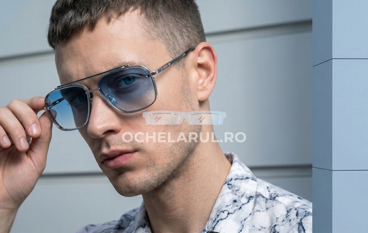 Bărbat purtând Ochelari de soare Dita Mach Six Style cu rame argintii și lentile albastre degrade de la ochelarul.ro.