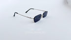 Ochelari de soare Dreptunghiulari Rimless cu lentile negre și brațe argintii, design minimalist și elegant.