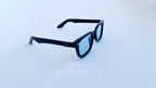 Ochelari de soare Moscot Klutz Style cu rame negre și lentile albastre, design pentru bărbați.