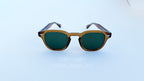 Ochelari de soare Moscot Lemtosh Style cu rame maro și lentile verzi pentru bărbați, stil clasic și elegant.