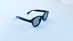 Ochelari Moscot Lemtosh Style - Polarizați Fotocromatici cu rame negre și lentile gri pentru protecție solară optimă.