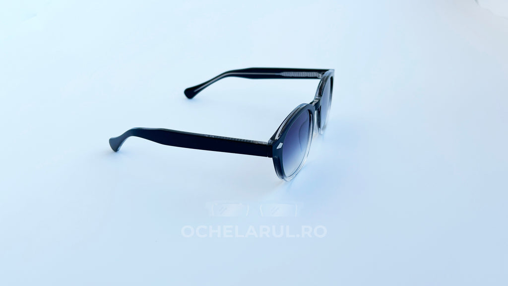 Ochelari de soare Moscot Lemtosh Style cu rame negre și lentile violet degrade, design unisex modern.