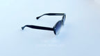 Ochelari de soare Moscot Lemtosh Style cu rame negre și lentile violet degrade, design unisex modern.