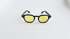 Ochelari de soare Moscot Lemtosh Style cu rame negre și lentile galbene, eleganți și moderni pentru bărbați.