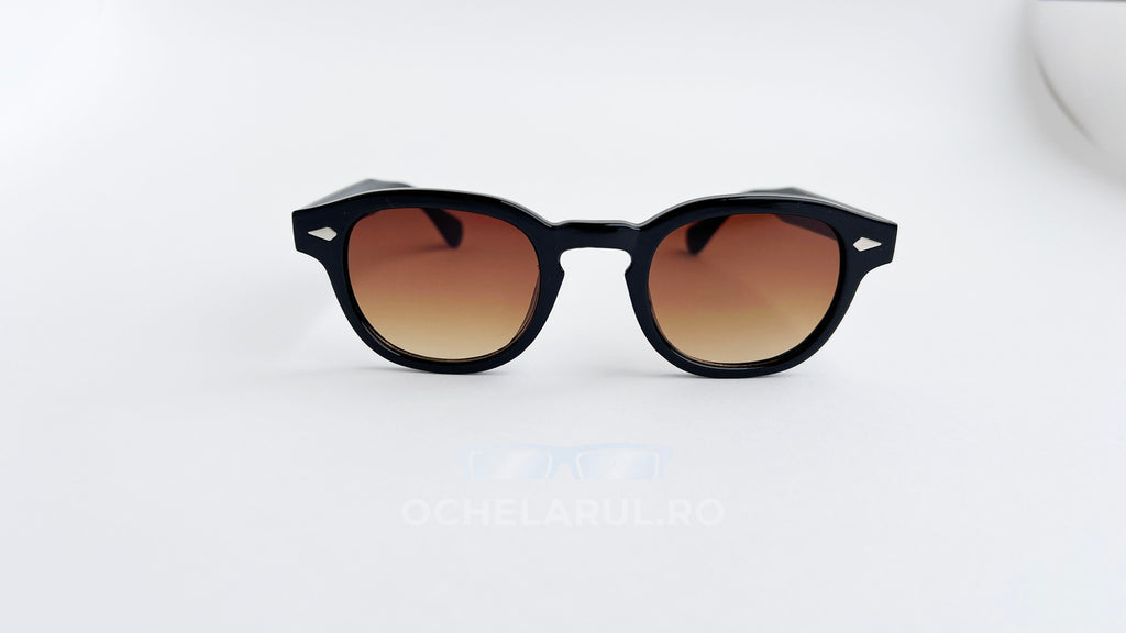 Ochelari de soare Moscot Lemtosh Style cu rame negre și lentile maro degrade, model clasic unisex pentru protecție solară.
