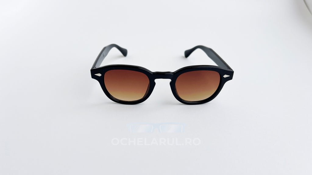 Ochelari de soare Moscot Lemtosh Style cu rame negre și lentile maro degrade, într-un design clasic pentru bărbați.