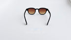 Ochelari de soare Moscot Lemtosh Style cu rame negre și lentile maro degrade, stil unisex elegant.
