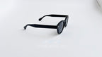 Ochelari de soare Moscot Lemtosh Style cu rame negre mate și lentile întunecate pentru protecție UV.