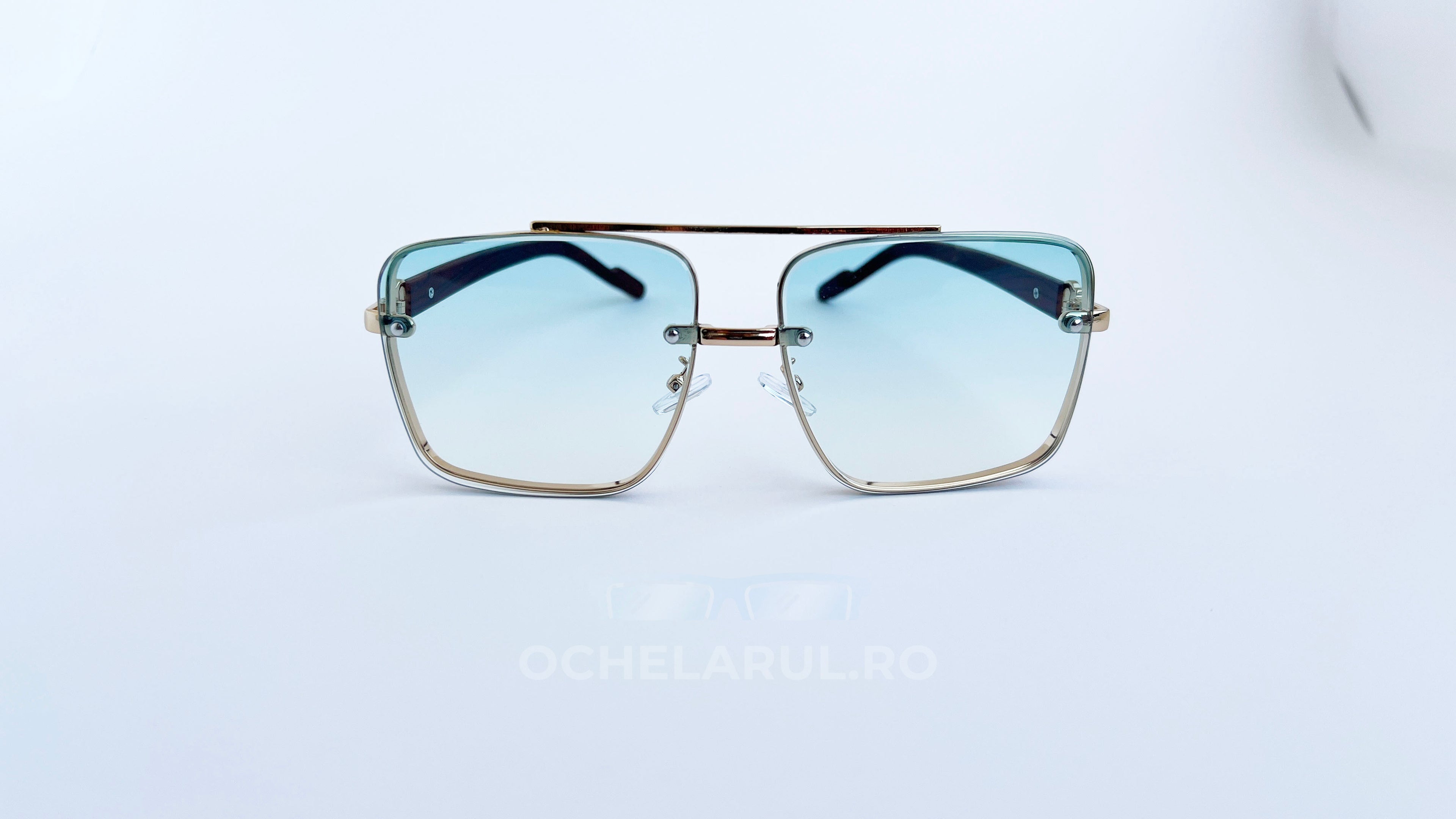 Ochelari de soare Patrati Design Vintage cu rama aurie maro și lentile albastre degrade, model elegant unisex.