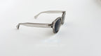 Ochelari de soare Moscot Lemtosh Style cu rame gri transparente și lentile negre polaroid pentru bărbați.