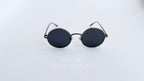 Ochelari de soare Rotunzi Polarizați cu rame gri și lentile negre, unisex, stil clasic și elegant pentru protecție solară.