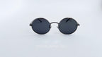 Ochelari de soare Rotunzi Polarizați cu lentile negre și rame gri, design modern și minimalist.