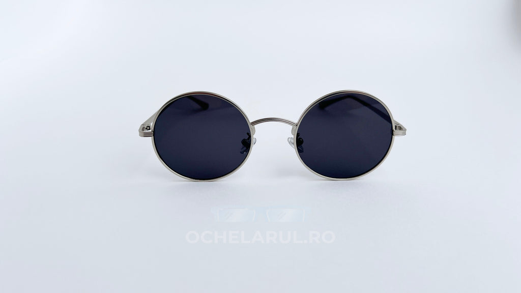 Ochelari de soare Rotunzi cu rame argintii și lentile negre, design clasic și elegant pentru bărbați.