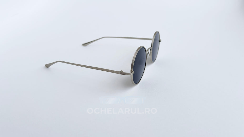 Ochelari de soare Rotunzi cu lentile negre și rame subțiri de culoare argintie, design minimalist pentru bărbați.