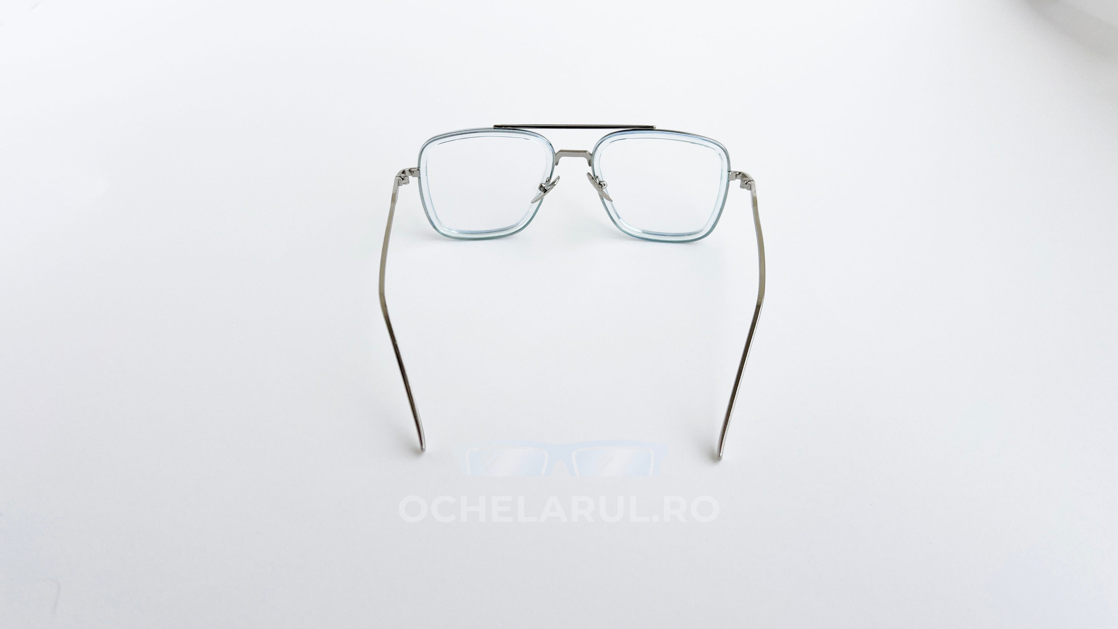 Ochelari Dita Flight dreptunghiulari, rama argintiu-verde si lentile transparente, vedere spate