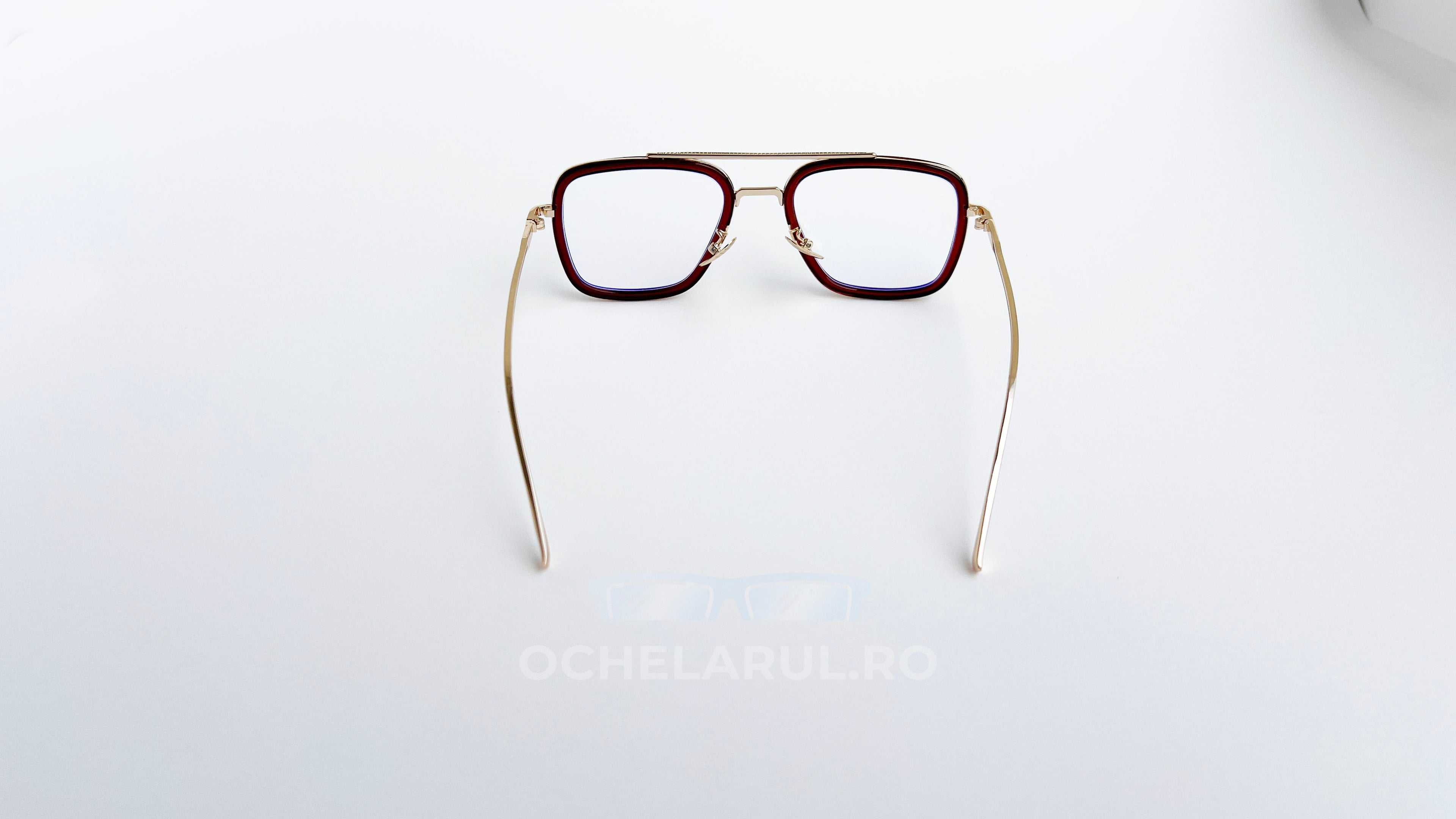 Ochelari Dita Flight Style cu rame maro aurii și lentile transparente, design elegant pentru bărbați.
