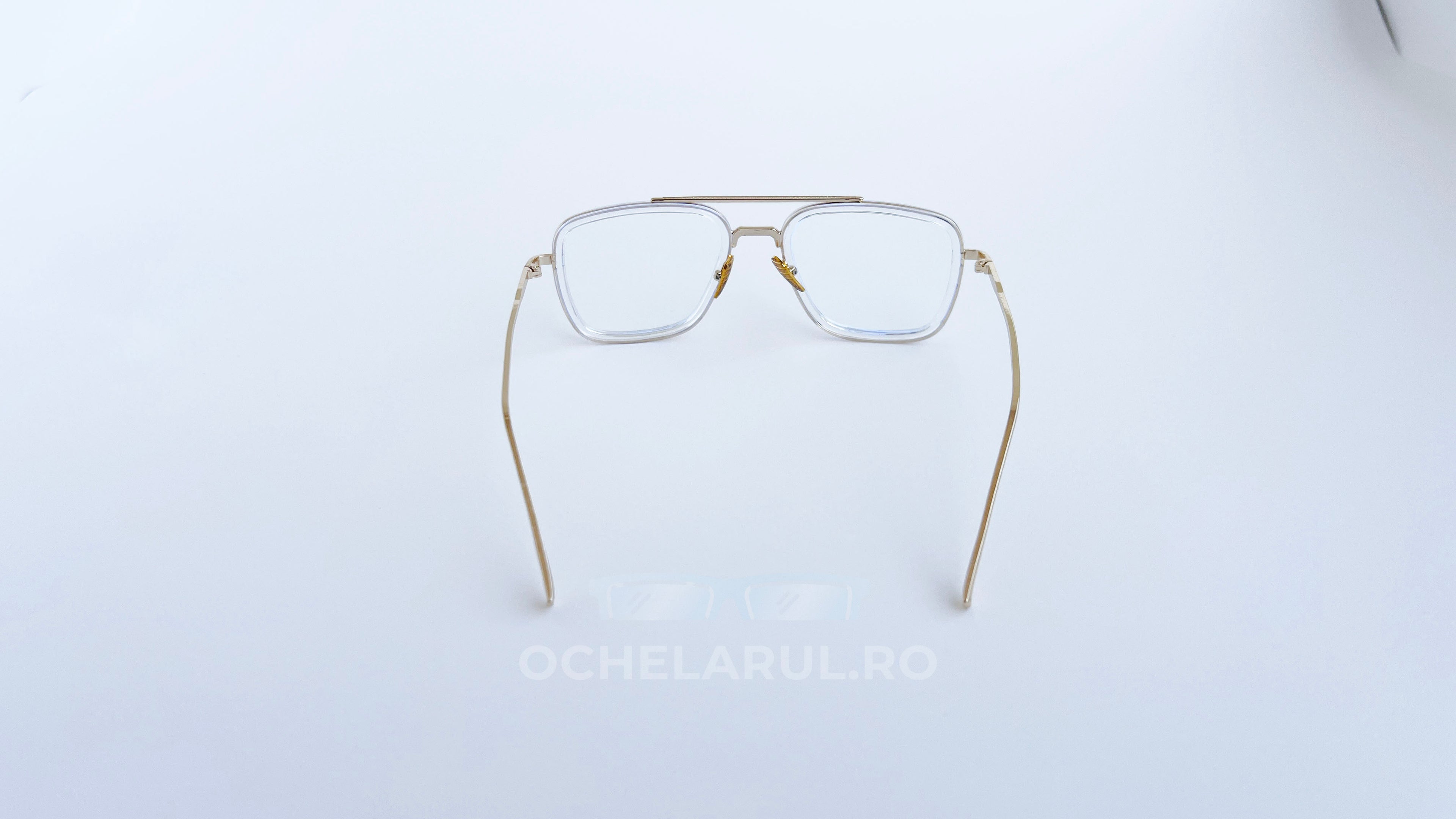 Ochelari Dita Flight Style cu rame aurii și lentile transparente, design modern și elegant pentru bărbați.