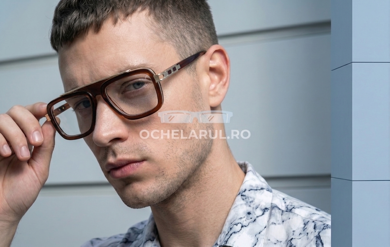 Bărbat purtând ochelari Dita LXN-EVO Style cu rama aurie maro și lentile transparente, ochelari bărbați de la ochelarul.ro.
