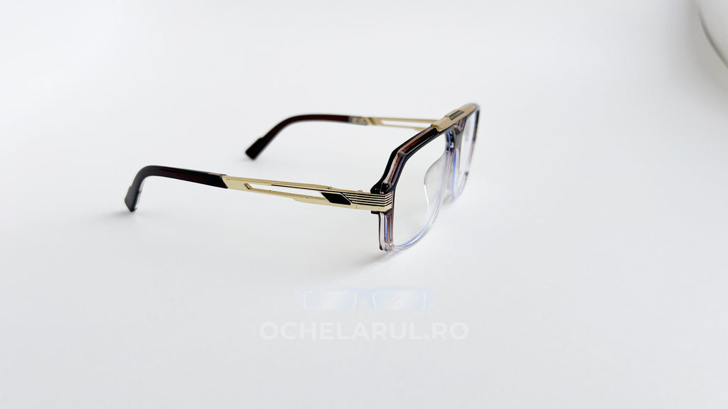 Rame ochelari Cazal 6034 Style cu design elegant aurii și maro, lentile transparente, pentru un aspect modern și rafinat.