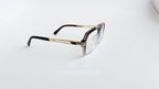 Rame ochelari Cazal 6034 Style cu design elegant aurii și maro, lentile transparente, pentru un aspect modern și rafinat.