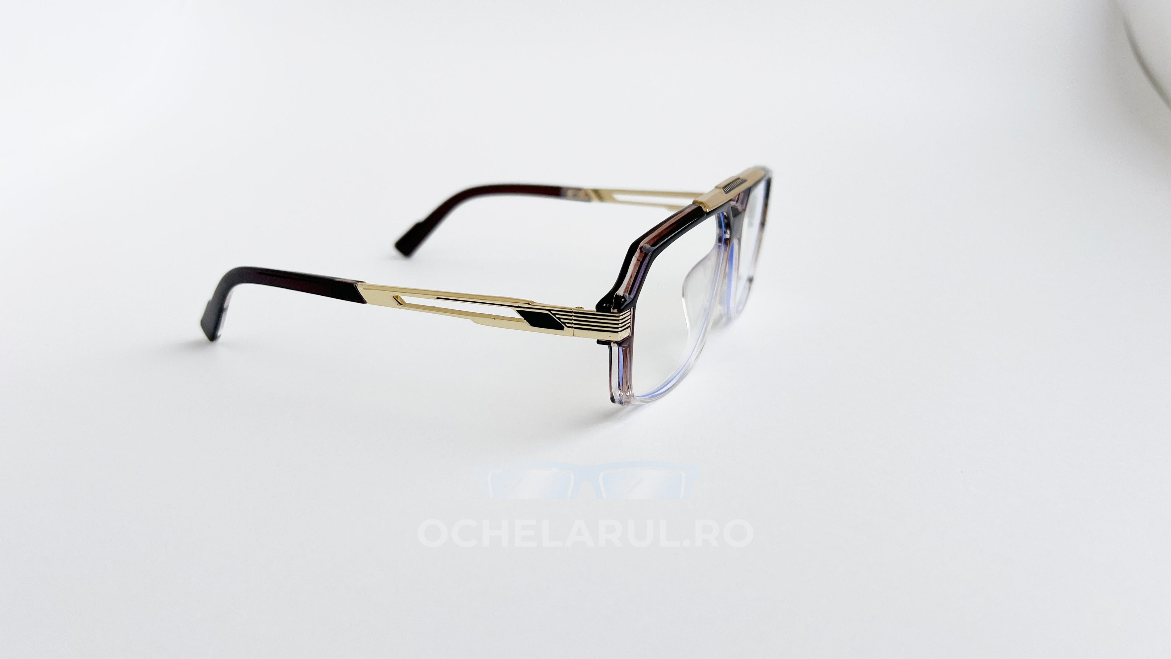 Rame ochelari Cazal 6034 Style cu design elegant aurii și maro, lentile transparente, pentru un aspect modern și rafinat.