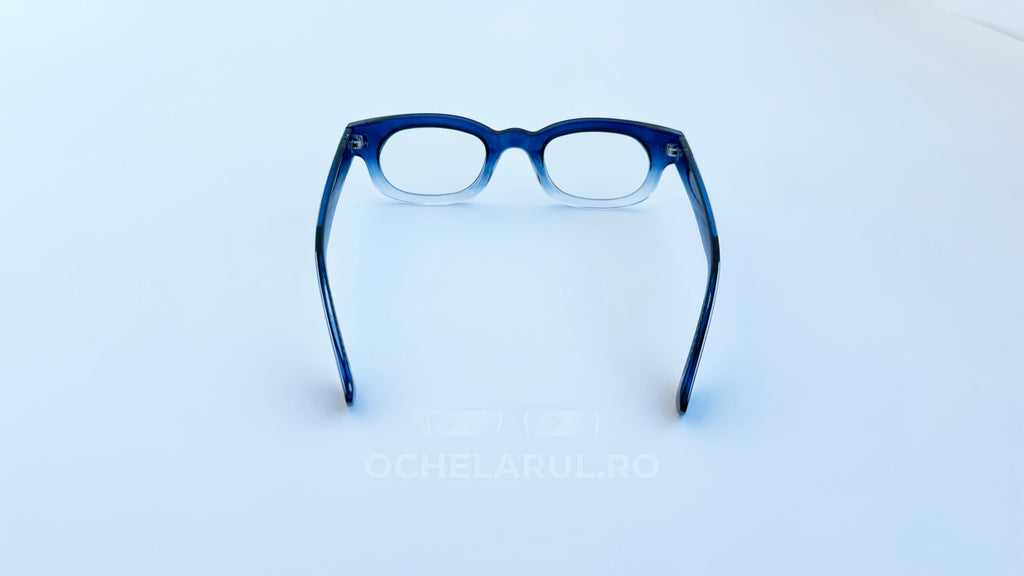 Rame ochelari Dreptunghiulare Elegante cu lentile transparente și cadru albastru, design modern și sobru.