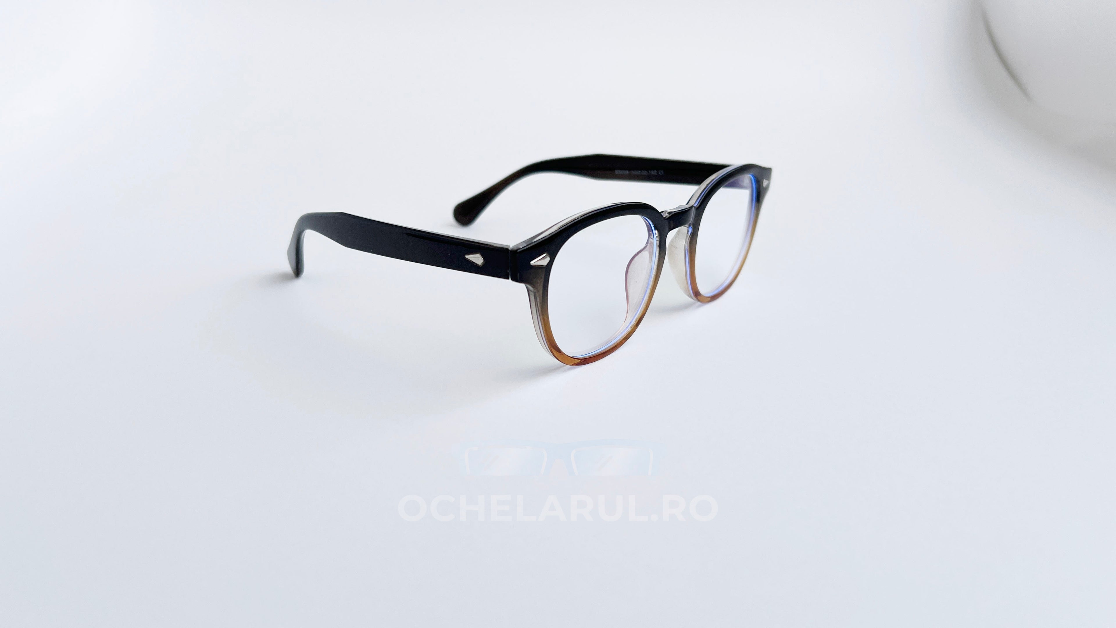 Rame ochelari Large Moscot Style în nuanțe degradate de maro cu lentile transparente, design elegant și modern.
