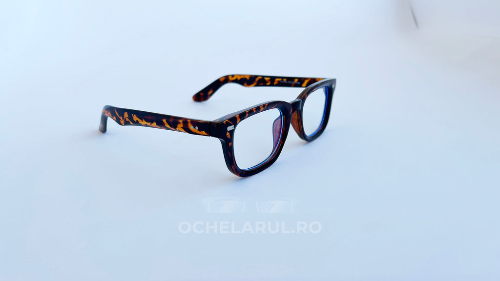 Rame ochelari Moscot Klutz Style cu design animal print și lentile transparente, ideale pentru look modern și distinctiv.