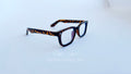 Rame ochelari Moscot Klutz Style cu design animal print și lentile transparente, ideale pentru look modern și distinctiv.