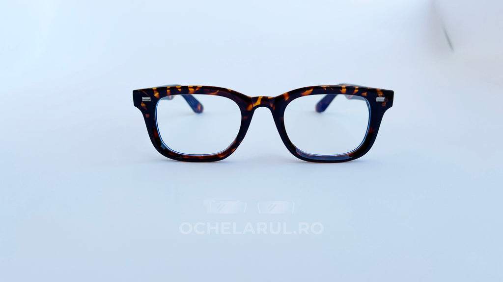Rame ochelari Moscot Klutz Style cu model animal print și lentile transparente, design clasic și elegant.