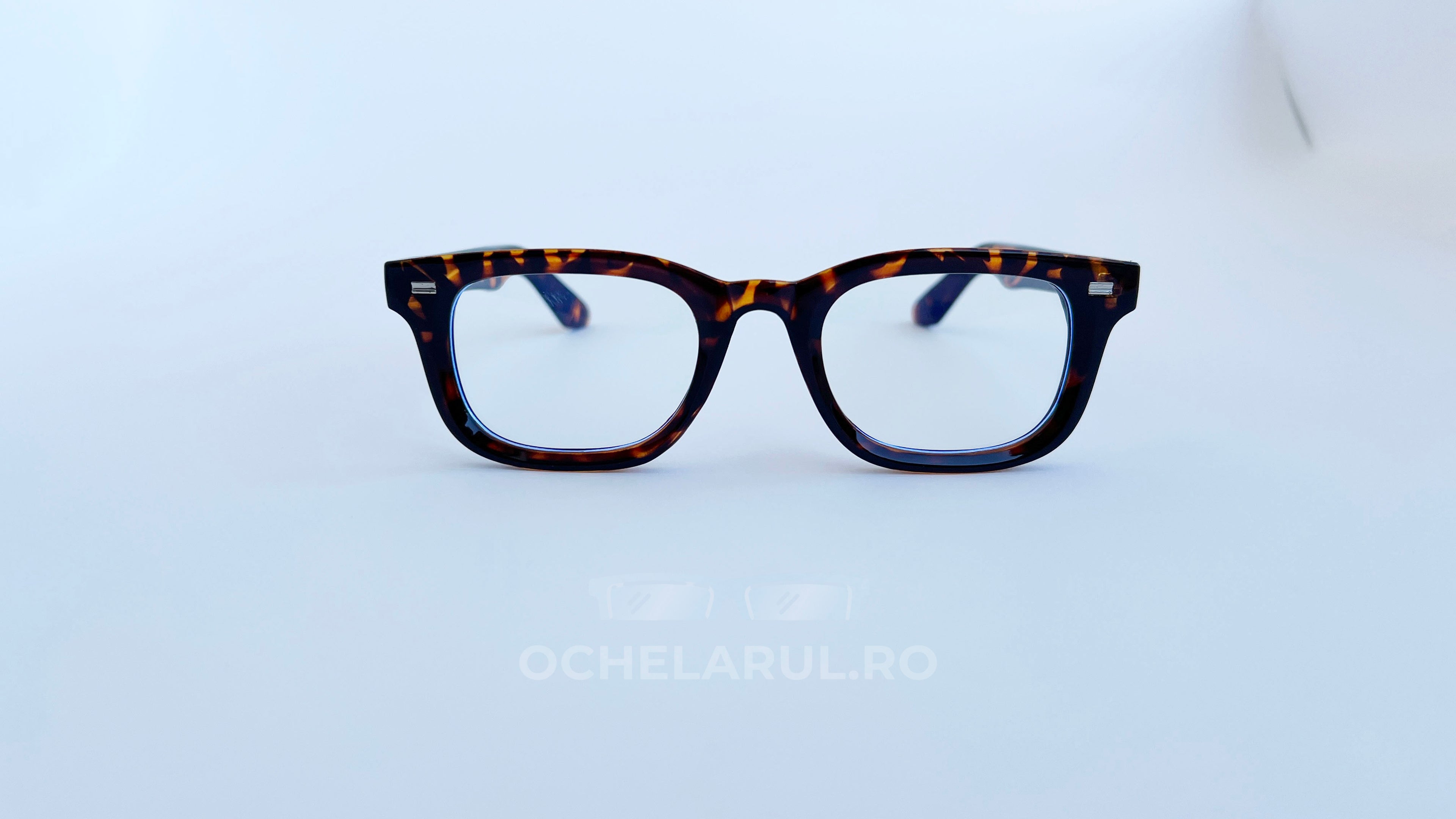 Rame ochelari Moscot Klutz Style cu model animal print și lentile transparente, design clasic și elegant.