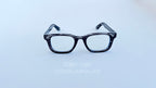 Rame ochelari Moscot Klutz Style cu design în dungi gri și lentile transparente, stil elegant și modern.