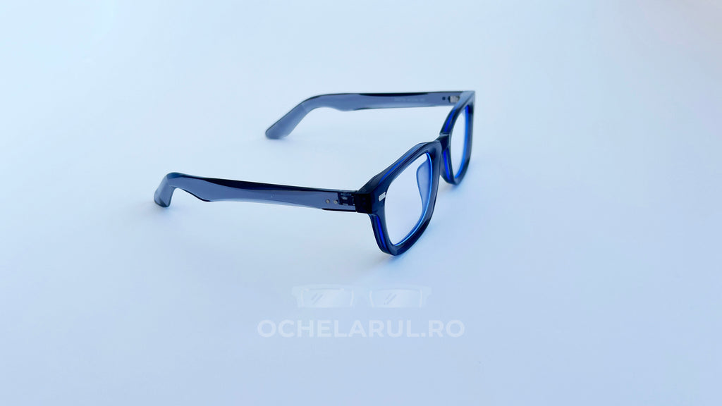 Rame ochelari Moscot Klutz Style albastre, un model elegant de rame ochelari cu lentile transparente, prezentate pe fundal alb.
