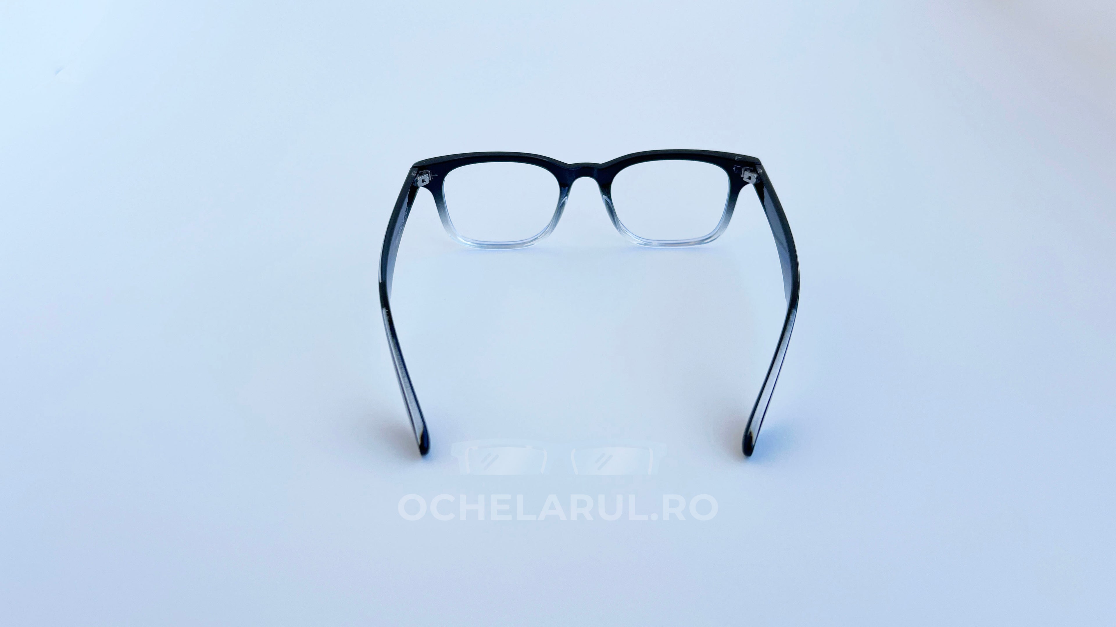 Rame ochelari Moscot Klutz Style negre degradate cu lentile transparente, design clasic și elegant.