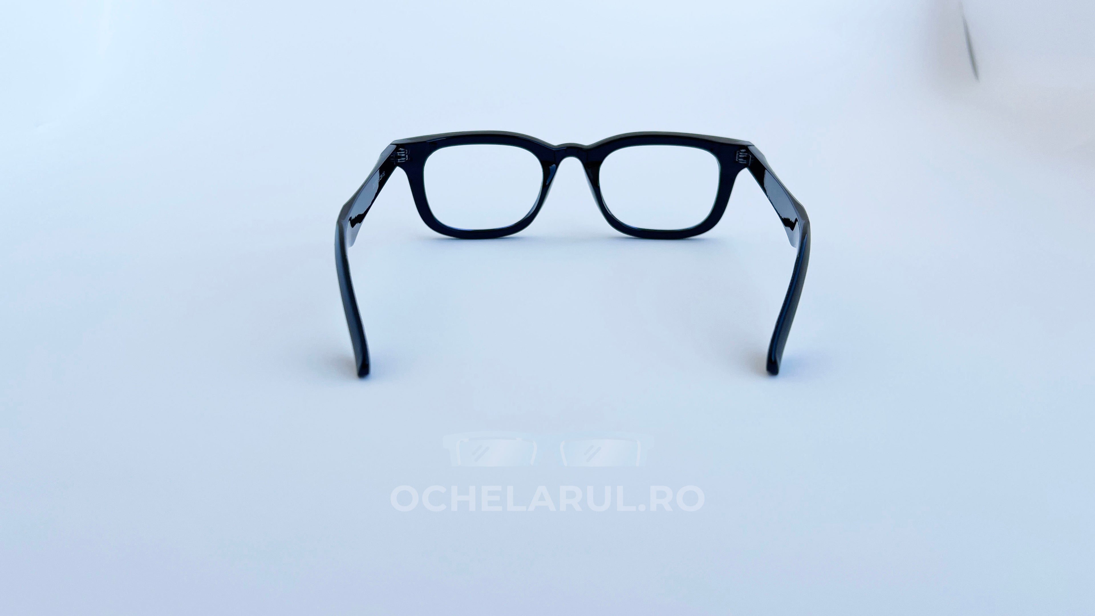 Rame ochelari Moscot Klutz Style negre, cu lentile transparente, design clasic și elegant pentru bărbați.