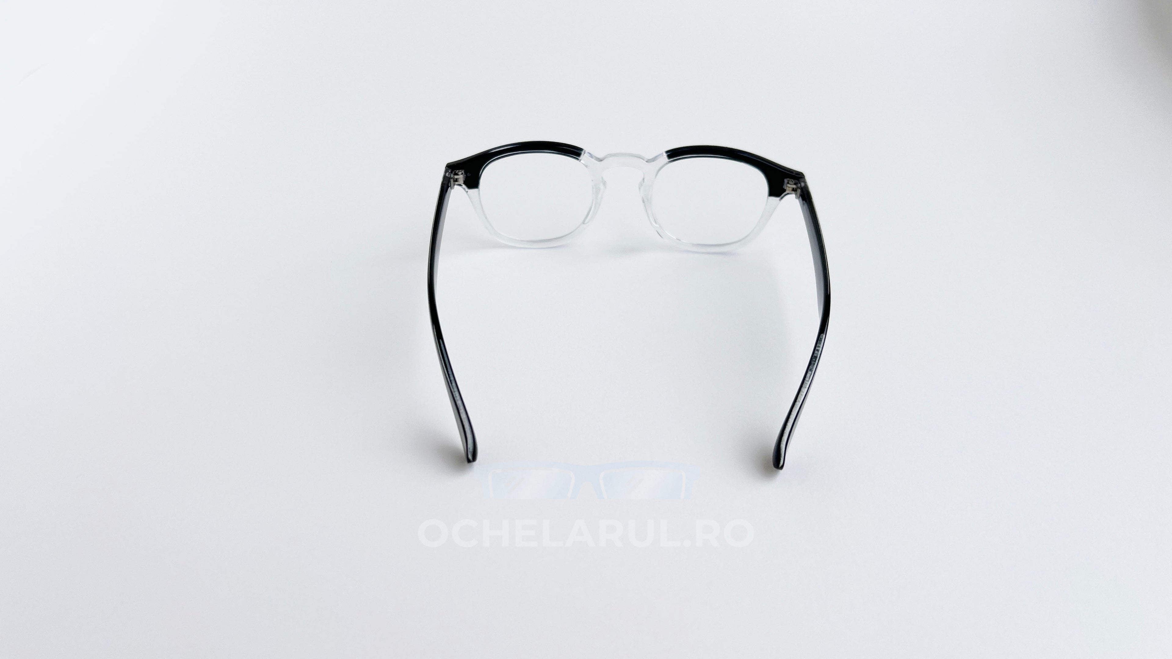 Rame ochelari Moscot Lemtosh Style cu cadrul negru transparent și lentile clare, design clasic și unisex.
