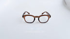 Rame ochelari Moscot Style maro transparent cu lentile transparente, design clasic și modern pentru bărbați.
