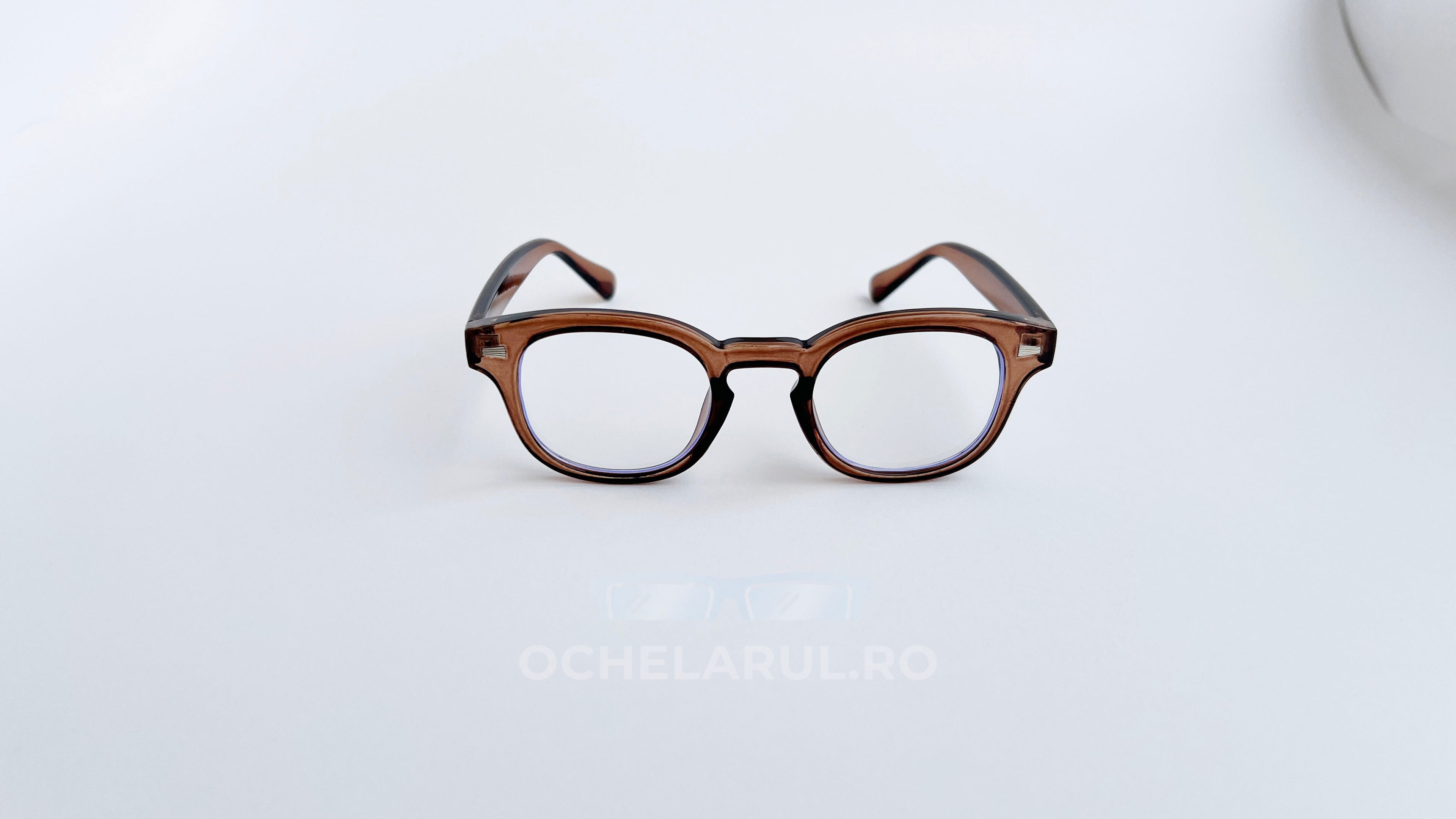 Rame ochelari Moscot Style maro transparent cu lentile transparente, design clasic și modern pentru bărbați.