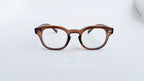 Rame ochelari Moscot Style cu lentile transparente și cadru maro translucid pentru un look modern și elegant