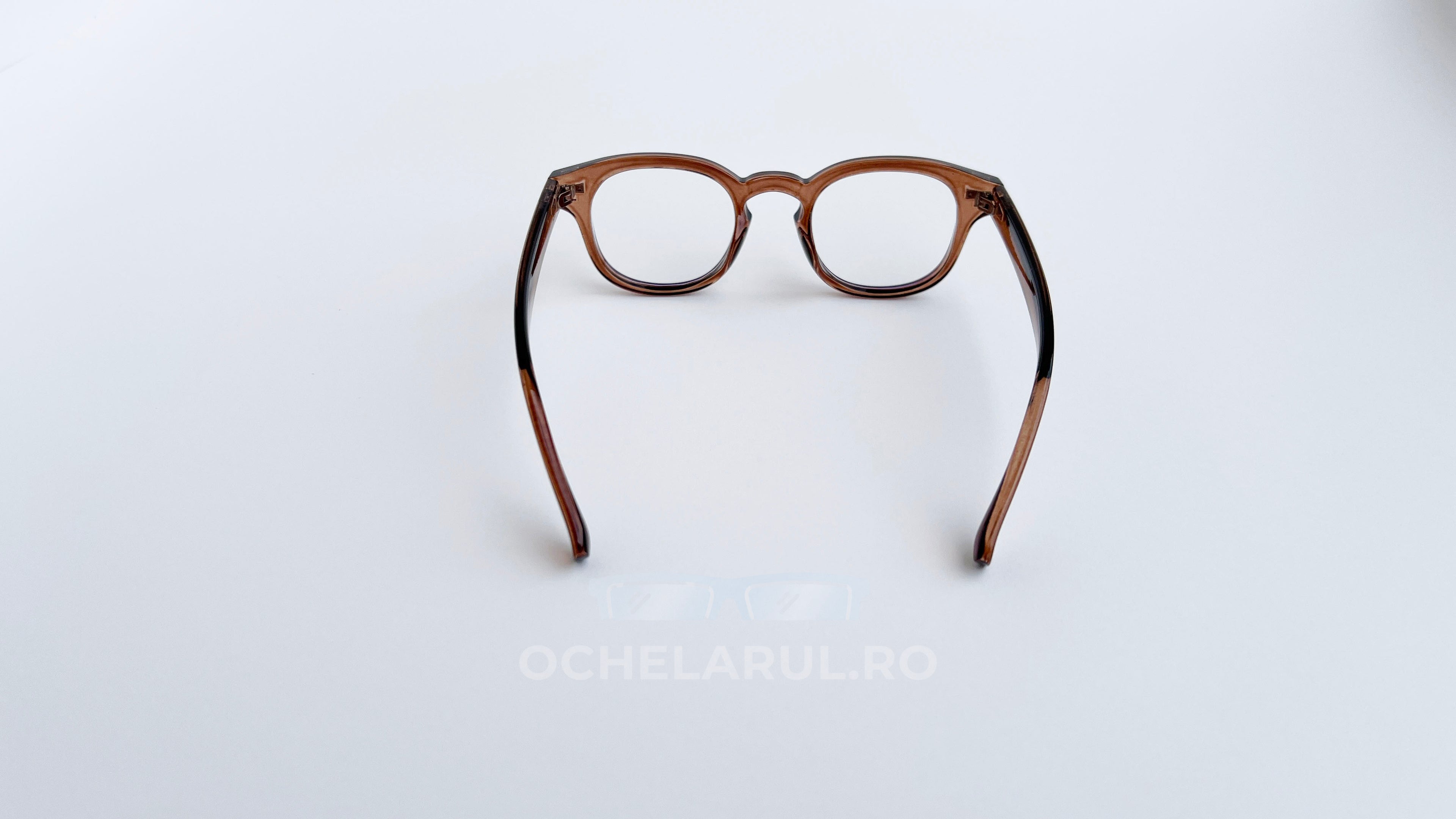 Rame ochelari Moscot Style maro transparent cu lentile clare, design clasic și elegant pentru ochelari de vedere.